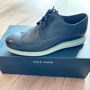 Cole Haan original wingtip oxfords in dark blue.